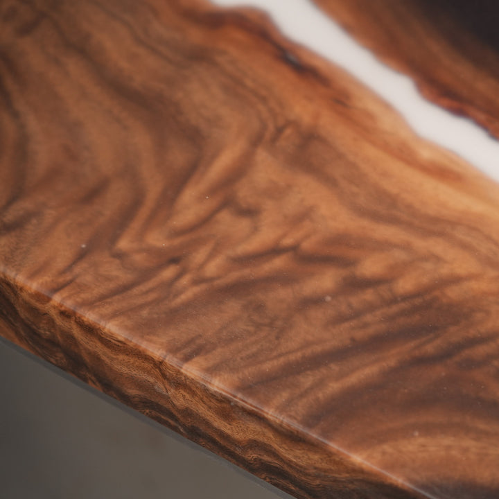 Custom walnut white epoxy river table displayed in dining room