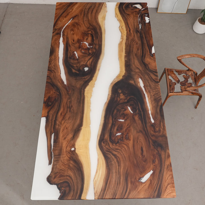 Straight edge detail of custom walnut epoxy river table