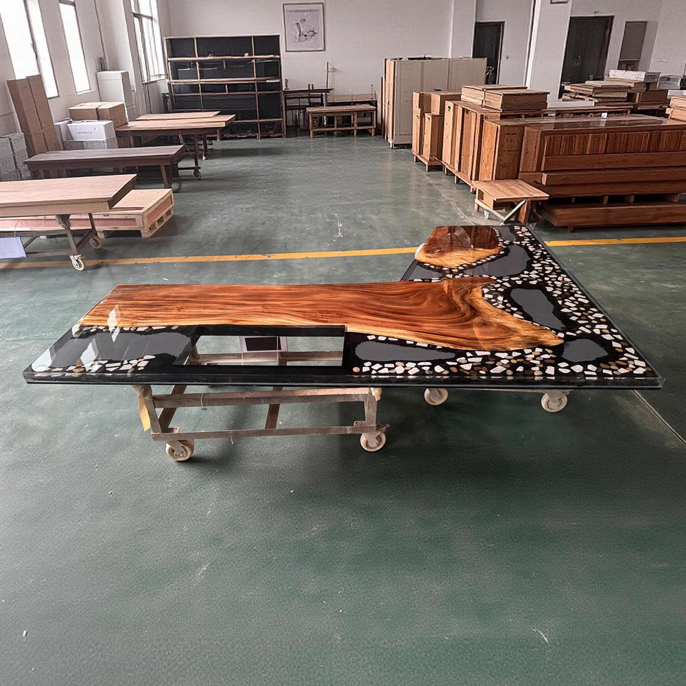 Top view of walnut L-shaped resin kitchen countertop showing custom layout and glossy finish