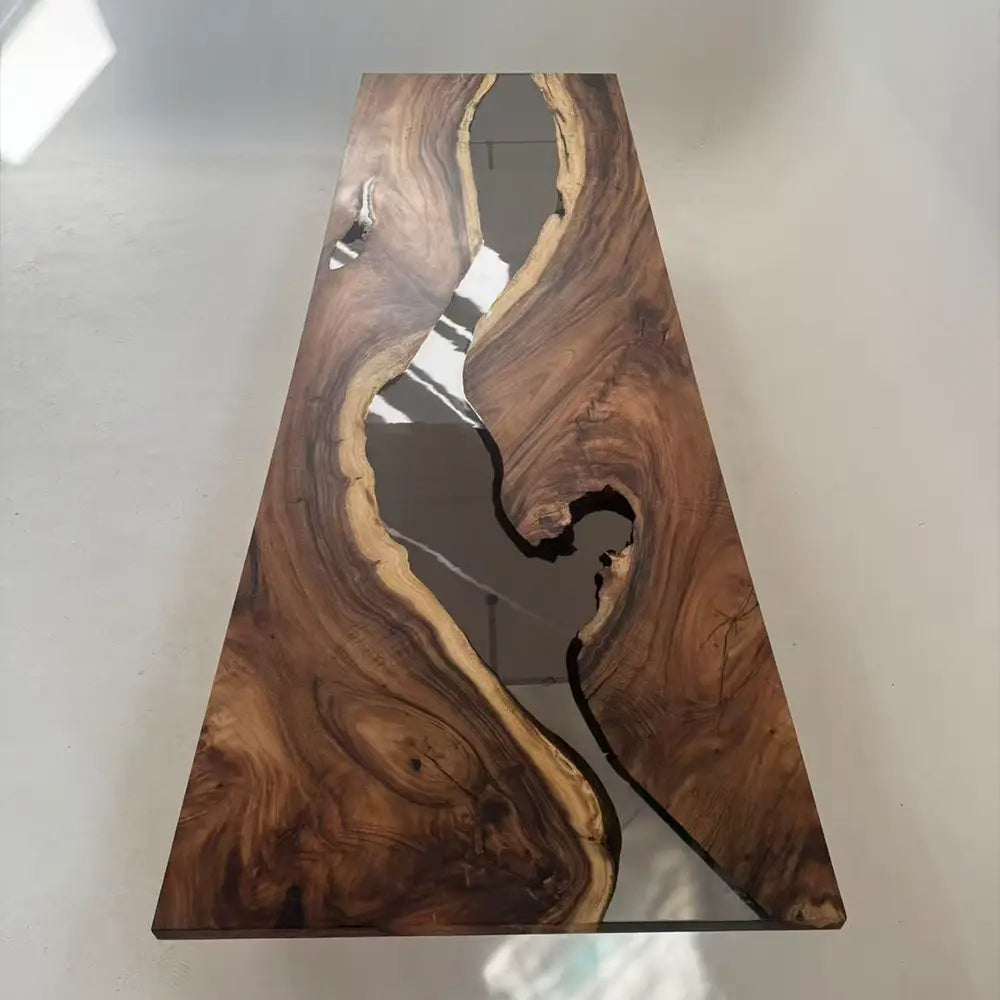 Sanding and finishing the walnut tabletop with glossy black resin