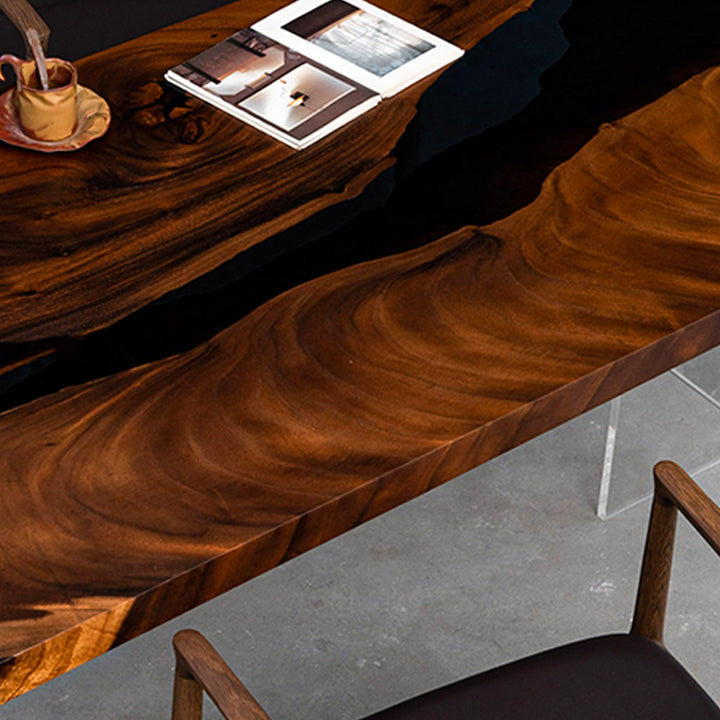 Integrated power outlet feature on CRT-241 walnut black resin executive table.