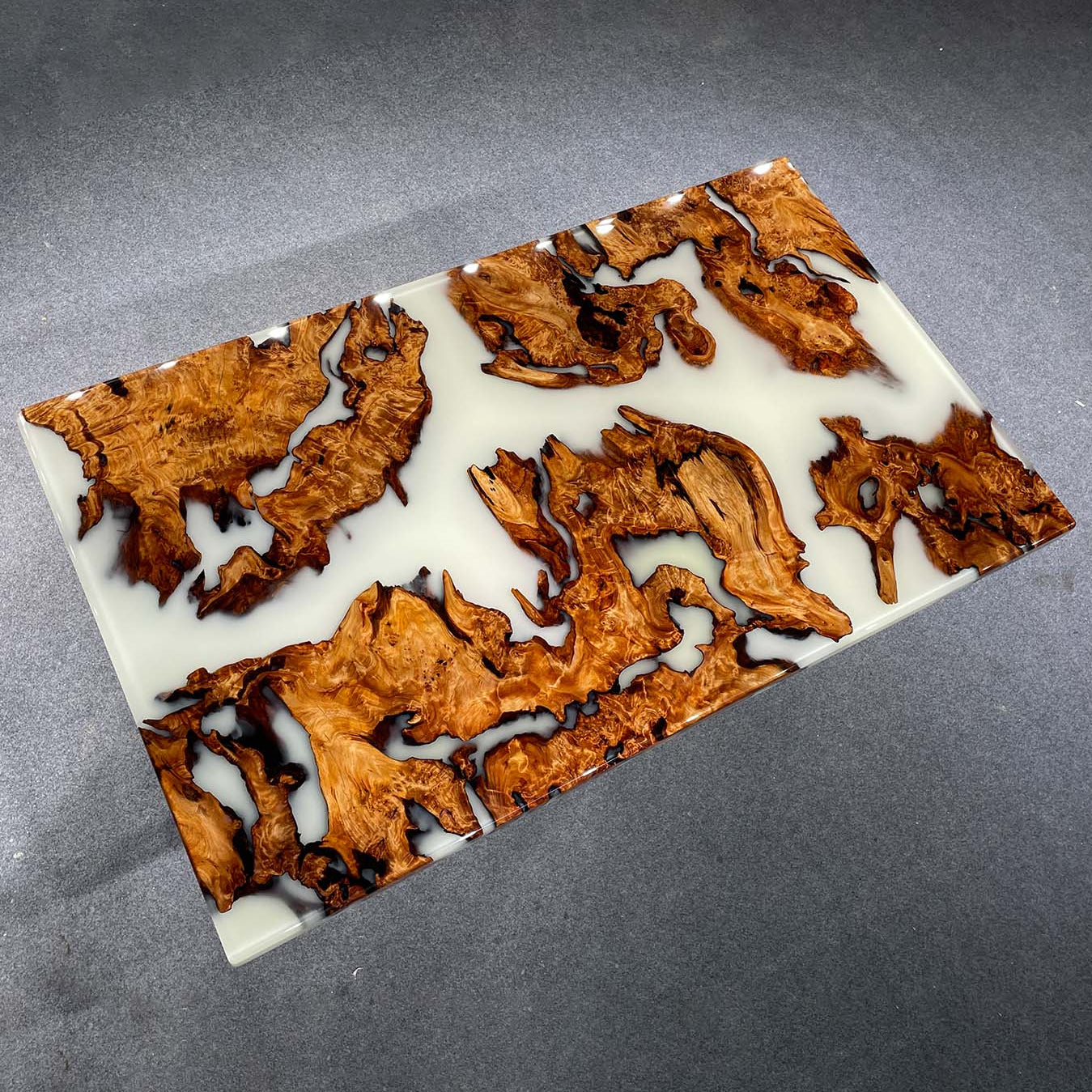 Handcrafted Cunninghamia wood dining table with white epoxy resin and natural live edge design.