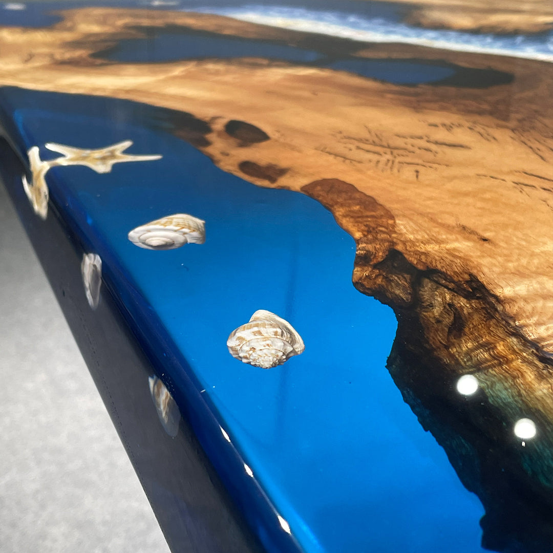 Close-up of a phone case with blue resin and wooden texture