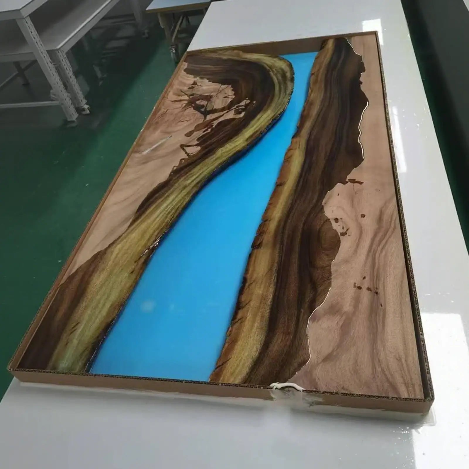 Wooden panel with blue resin inlay 