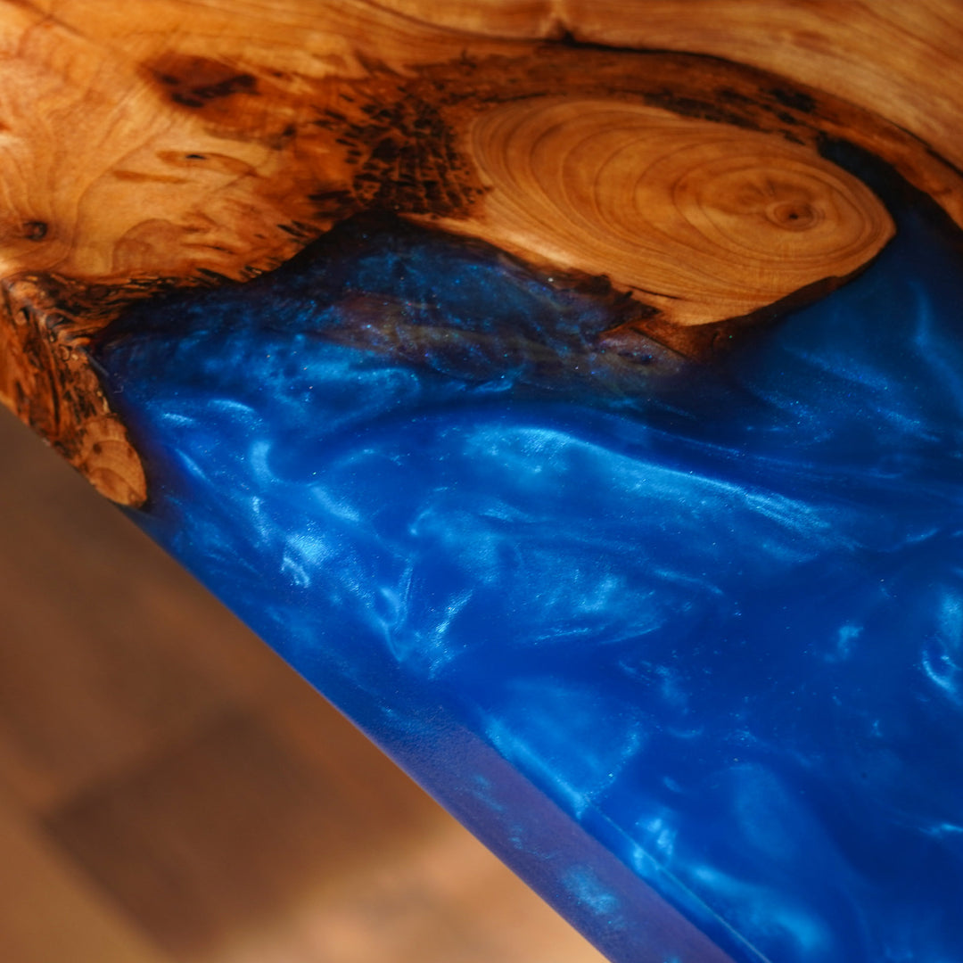 Wooden surface with blue resin inlay