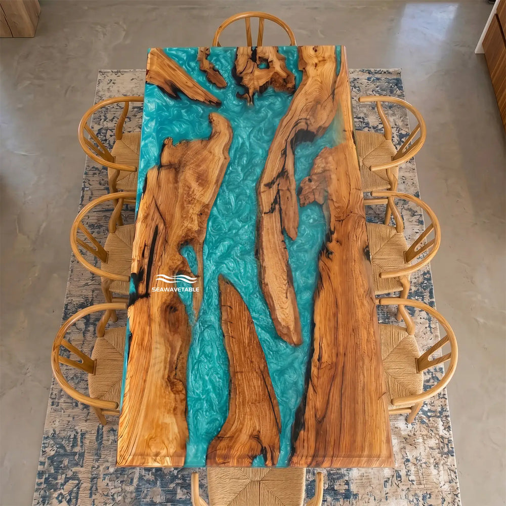 Custom olive wood epoxy dining table with turquoise resin beveled edge in modern interior setting