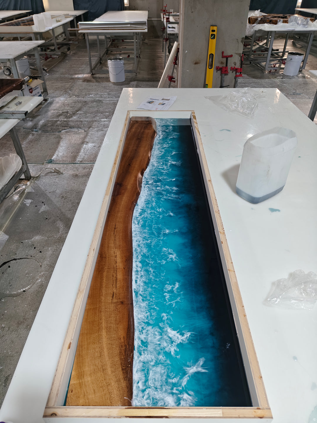 30% Deposit – Custom 110.5" Walnut & Ocean Wave Blue Epoxy Waterfall Bar Table