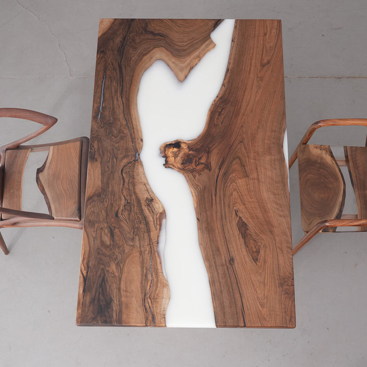 Solid wood dining table in black walnut and white epoxy for modern homes