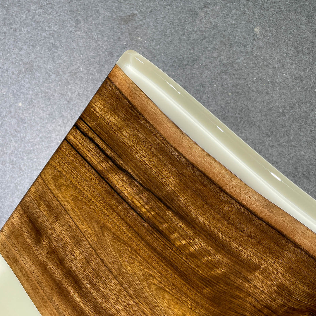 Wooden surface with a white edge on a gray background