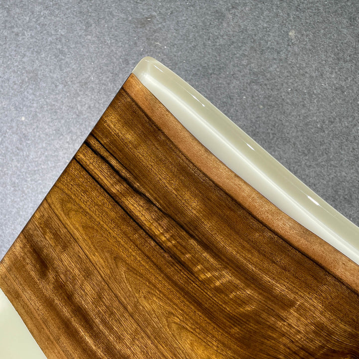 Wooden surface with a white edge on a gray background