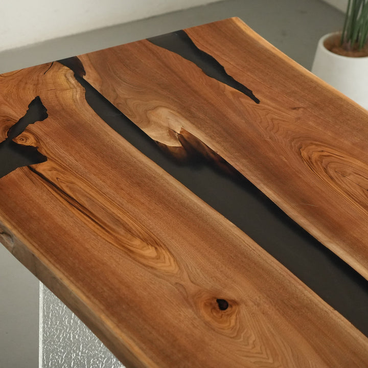 Handcrafted live edge table made from walnut wood and black resin for boardrooms