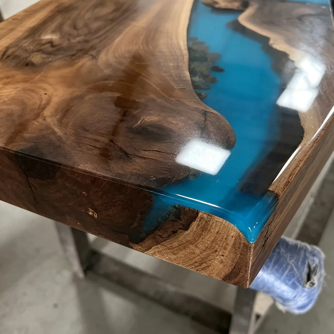 Glossy Black Walnut executive desk with blue epoxy river