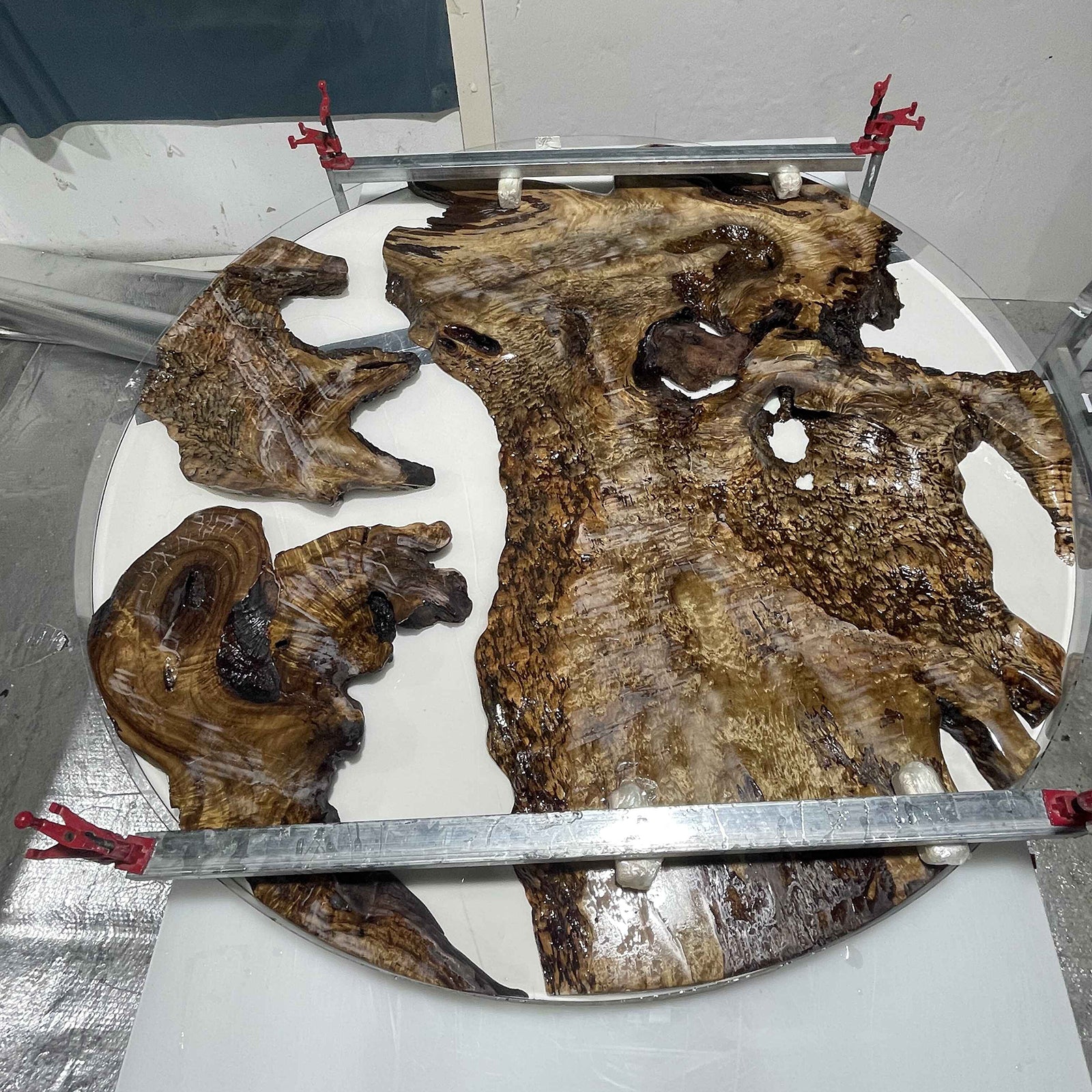 Detail shot showing Ocean Serenity resin waves on Golden Camphor round epoxy table