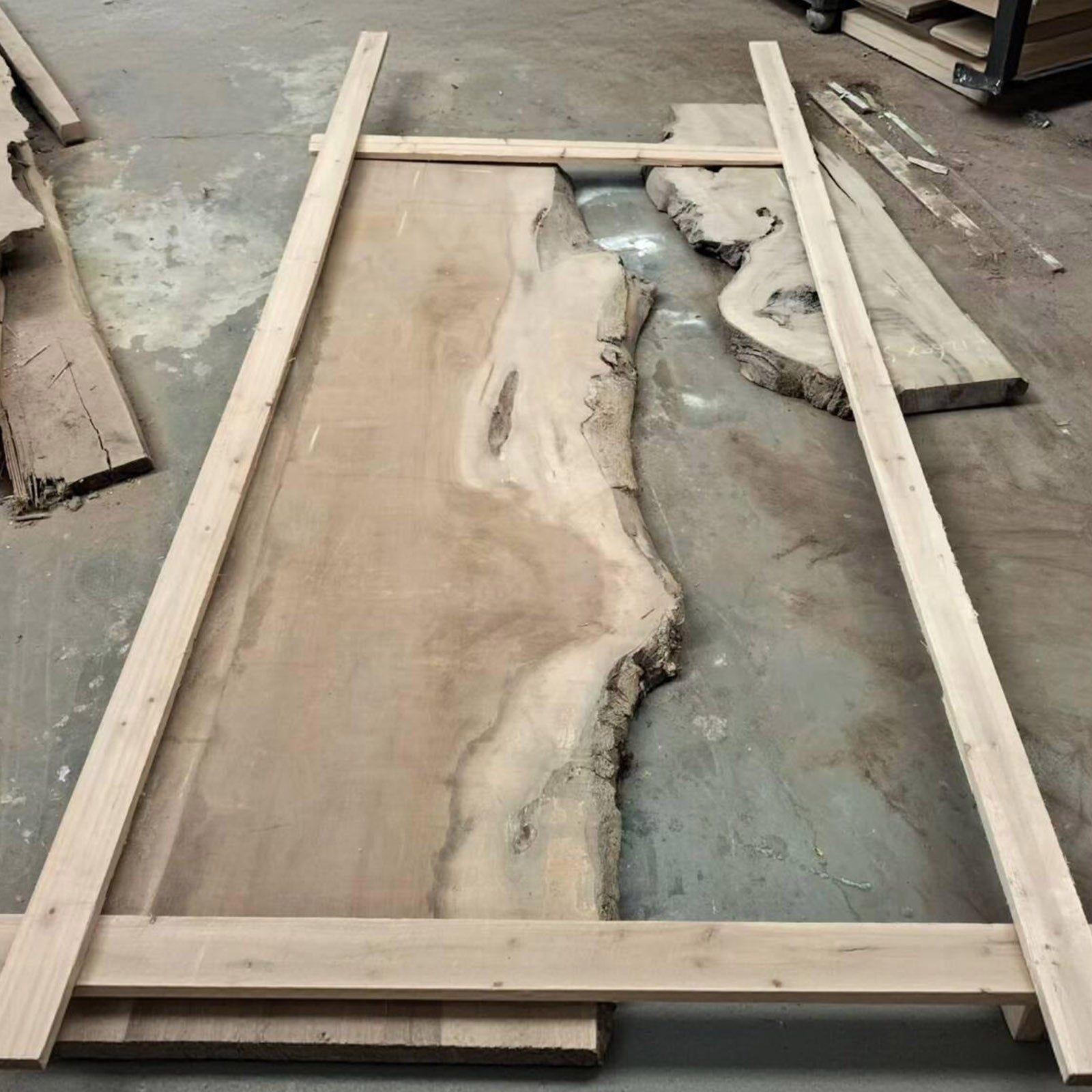 Handcrafted golden camphor wood dining table with blue and white ocean wave epoxy, elegant artisan design.