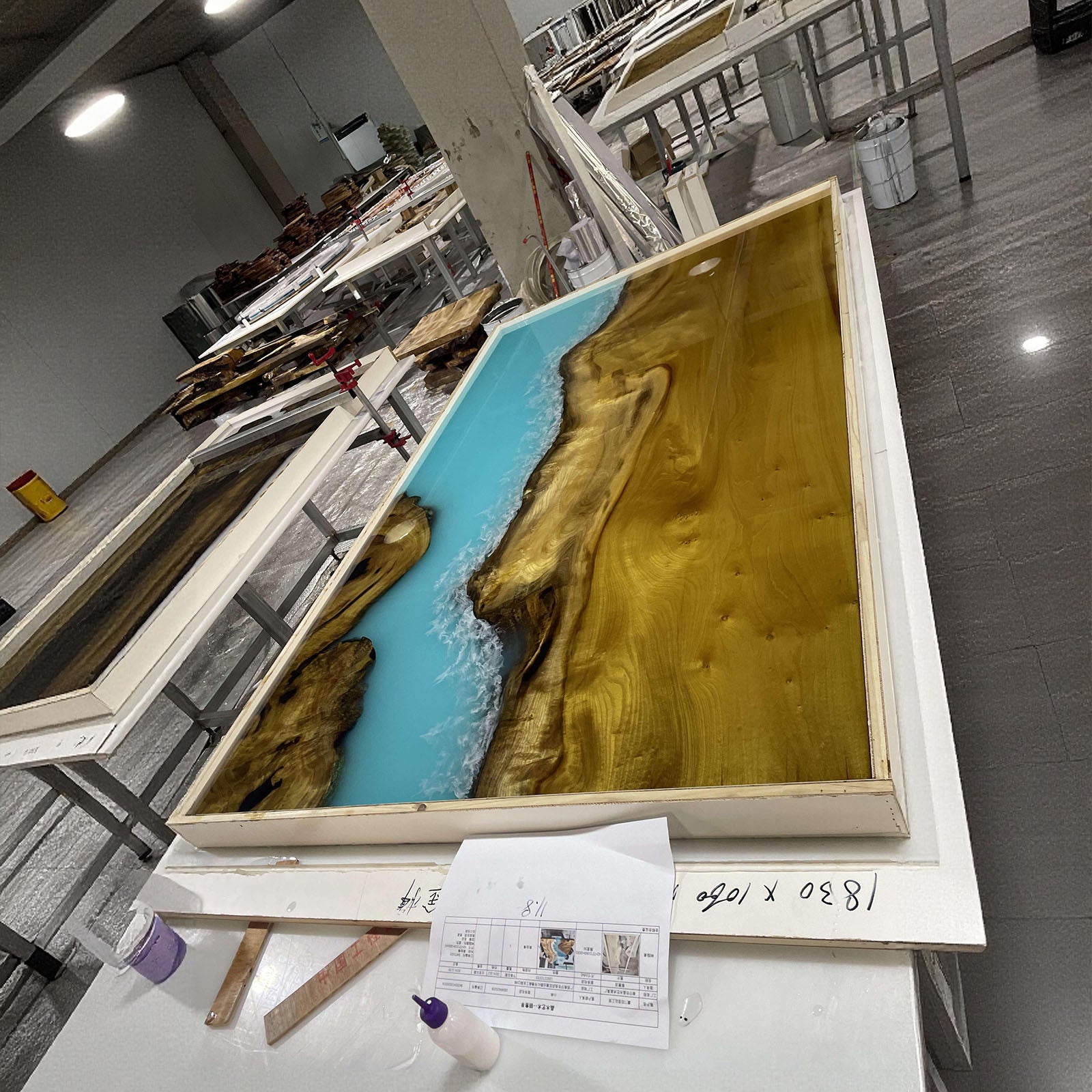 Luxury handmade Ocean Serenity dining table crafted from golden camphor and ocean wave epoxy resin.