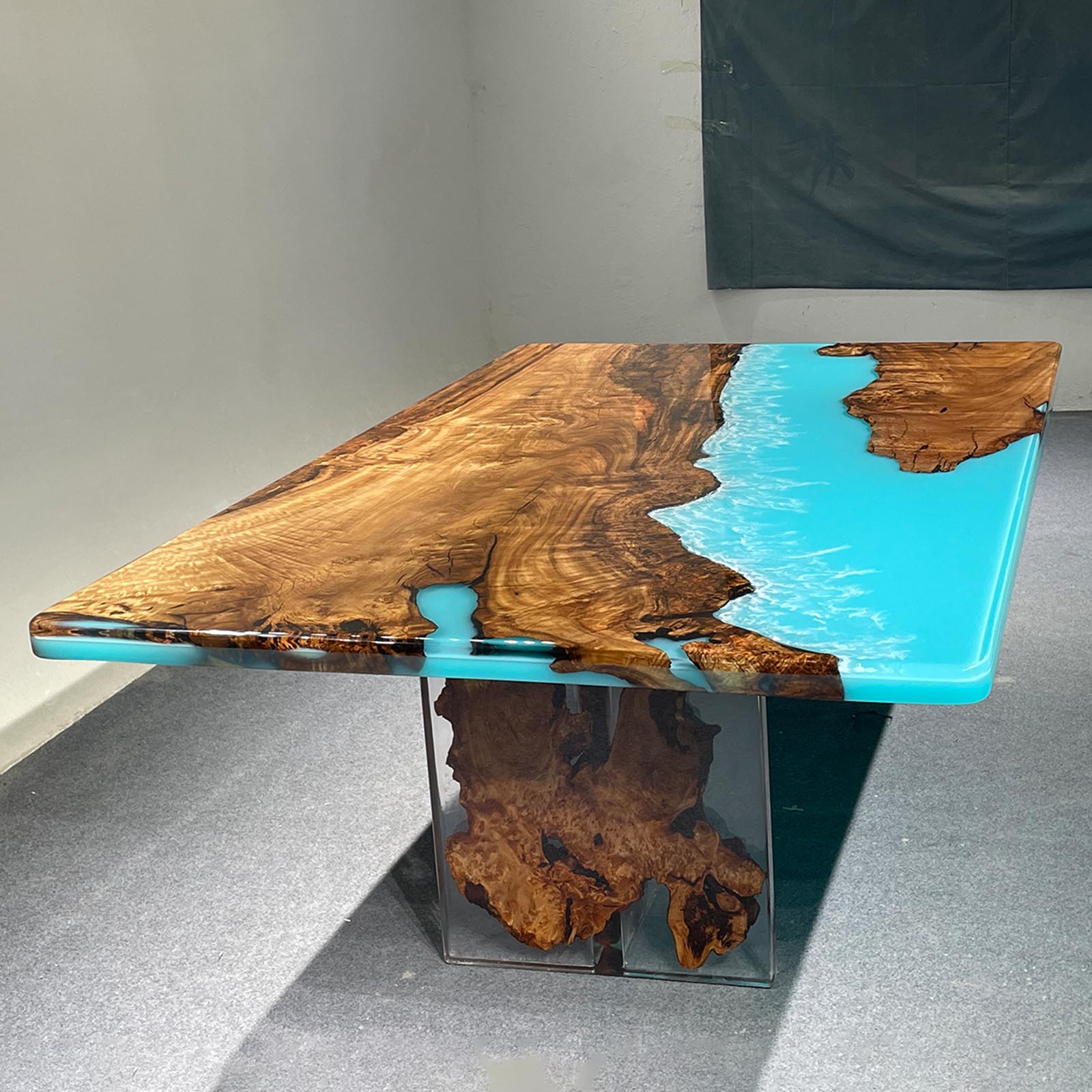 Handcrafted golden camphor wood Ocean Serenity epoxy river table by Seawavetable, inspired by ocean waves.