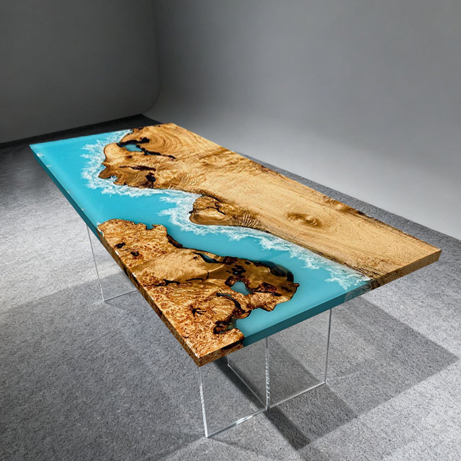 Live edge solid camphor wood table featuring serene ocean wave epoxy design.