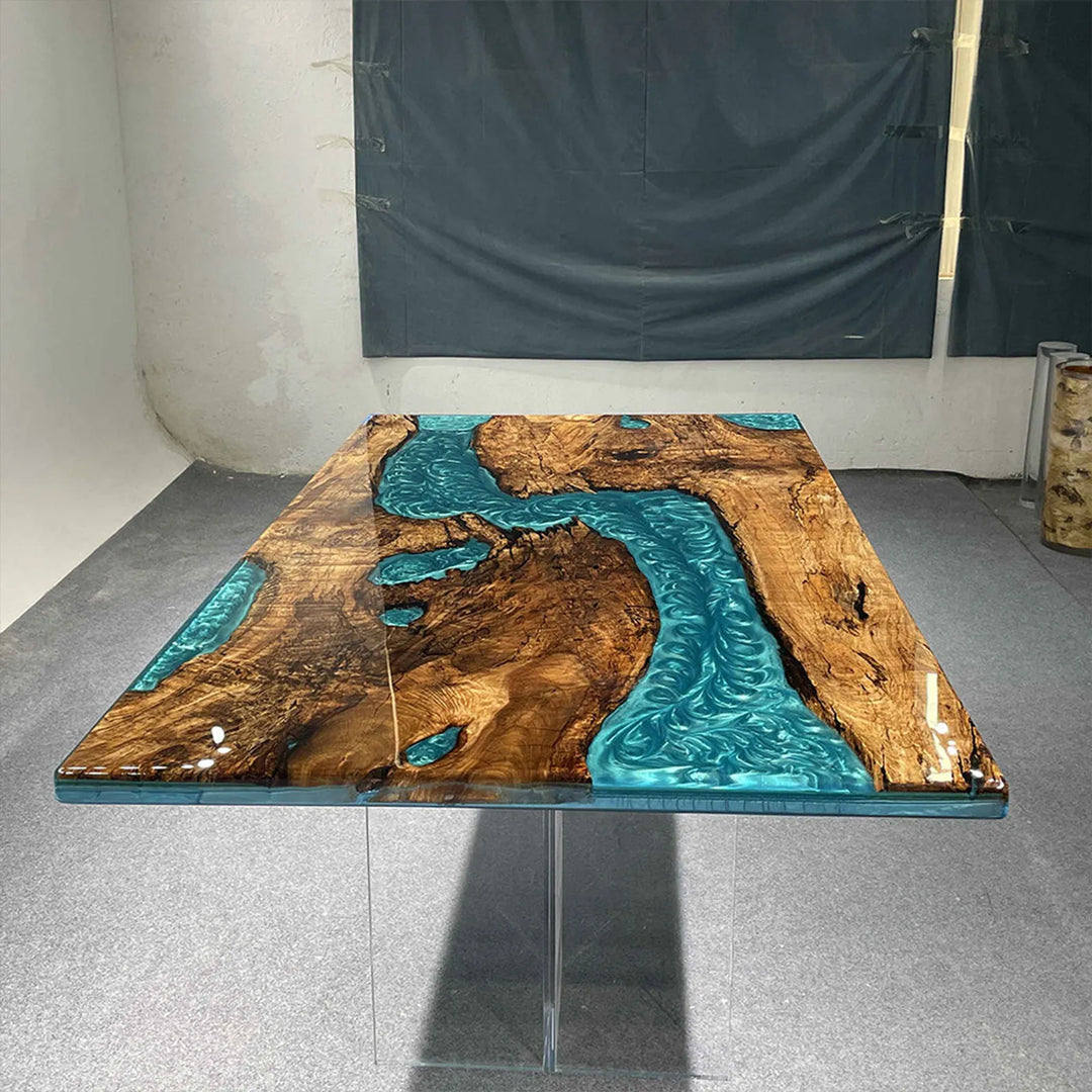 Layered gradient blue and clear epoxy detail on wood table