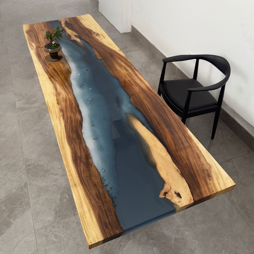 Handcrafted walnut river table with deep blue epoxy, coastal dining furniture near Charleston SC