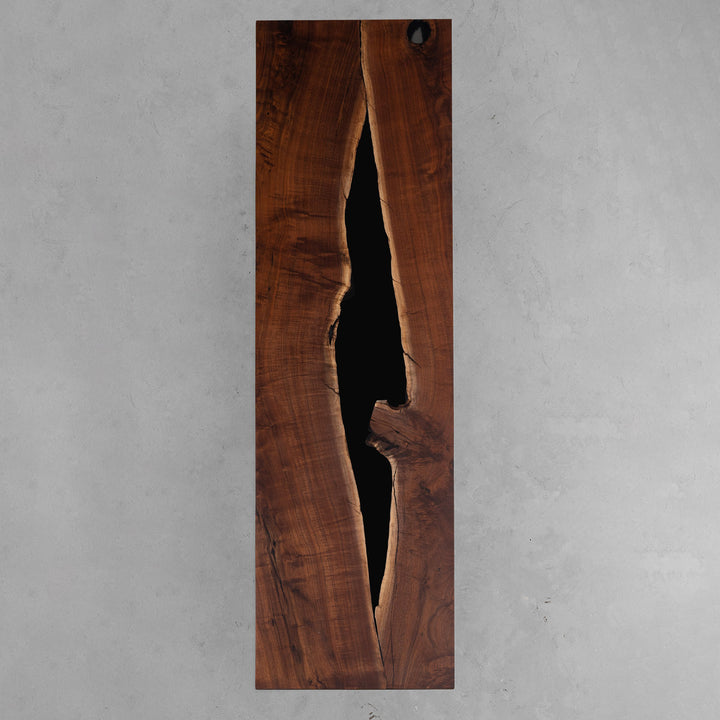 Straight edge detail of matte walnut and glossy resin executive meeting table