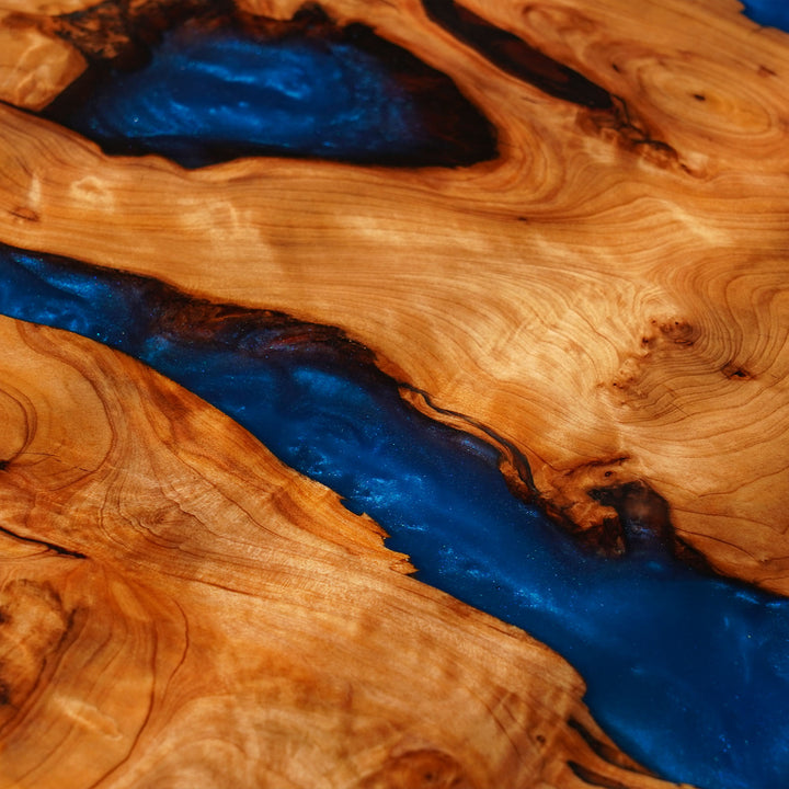 Wooden surface with blue resin flowing through it