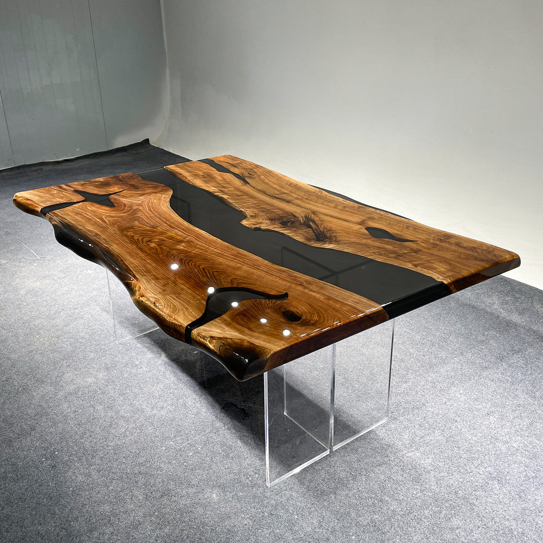 Dining table featuring a live edge wood slab with custom black epoxy