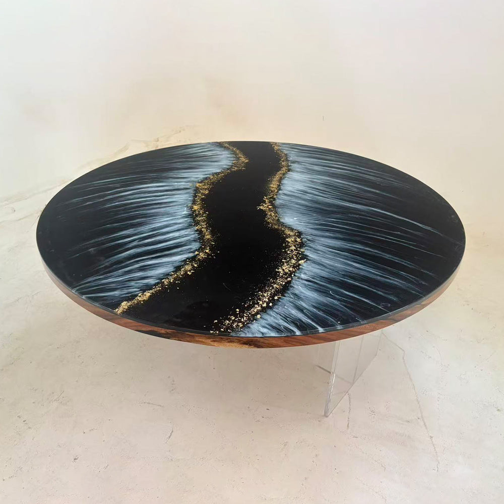 Handcrafted black and white resin table featuring ocean wave design and gold accents
