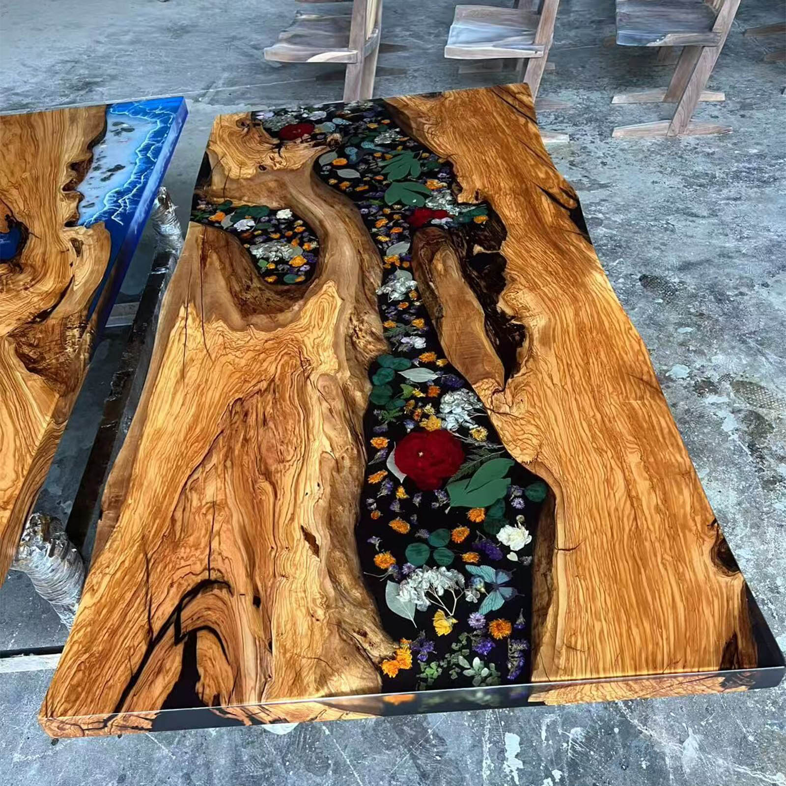 Surface texture and finish on California Luxe olive wood and black epoxy table.