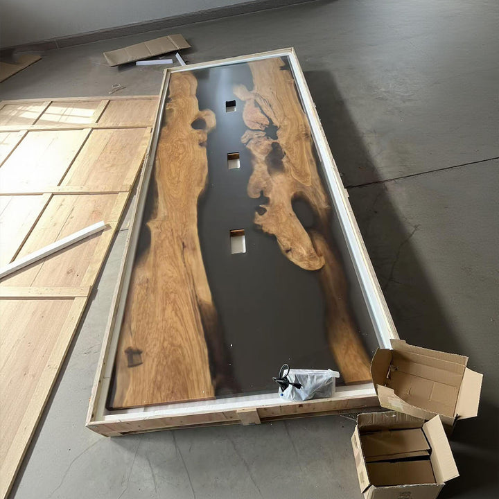 Top view of matte olive wood conference table with grey translucent resin and built-in power ports