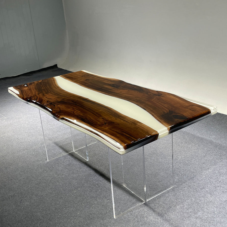 Wooden bench with clear acrylic legs on a gray floor