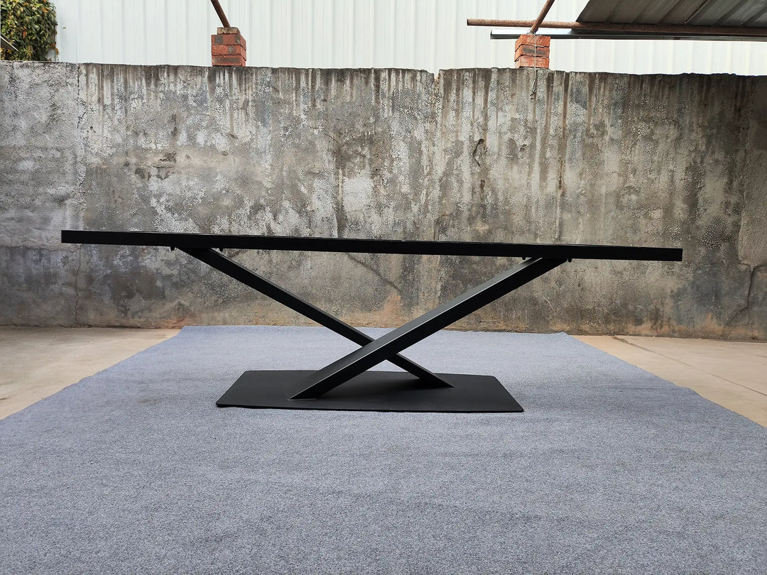 Side profile of the MTL17 X-shaped metal table base showing the crossed supports and flat rectangular base