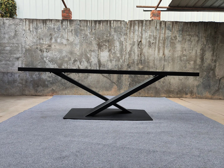 Side profile of the MTL17 X-shaped metal table base showing the crossed supports and flat rectangular base