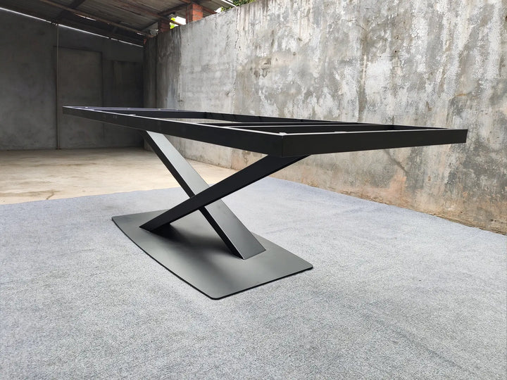 Angled view of the MTL17 black metal table base showing its X-shaped structure and tabletop support frame