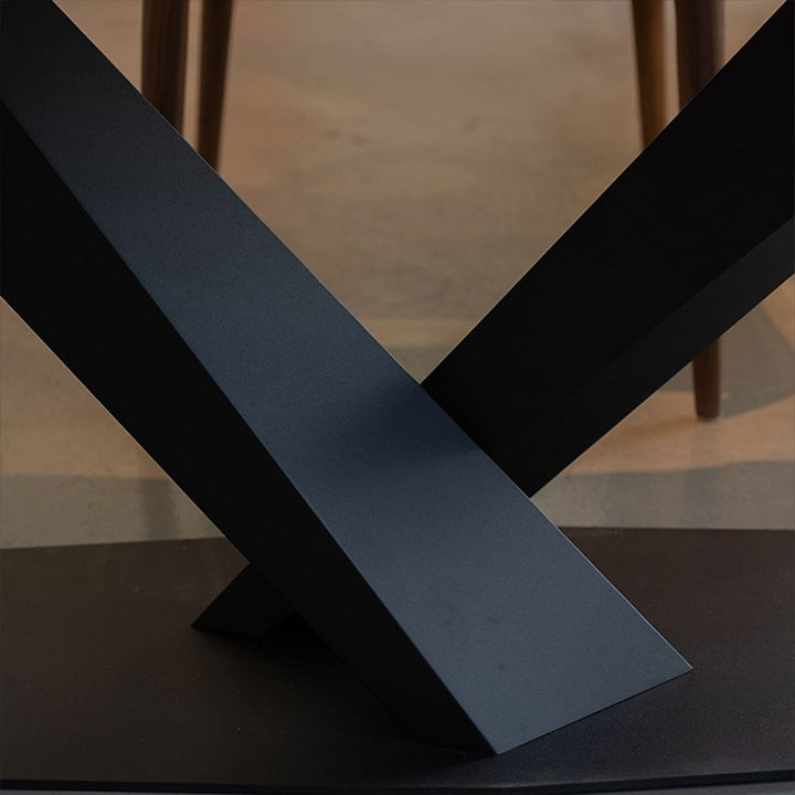 Close-up of the intersecting metal supports on the MTL17 sculptural X-shaped table base