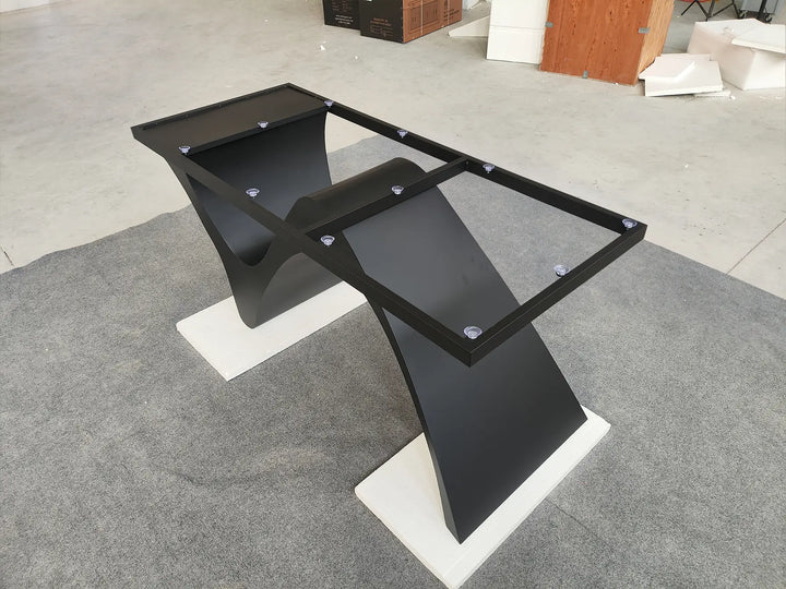 Side view of the MTL20 black and silver metal table base with curved structural supports and an upper mounting frame