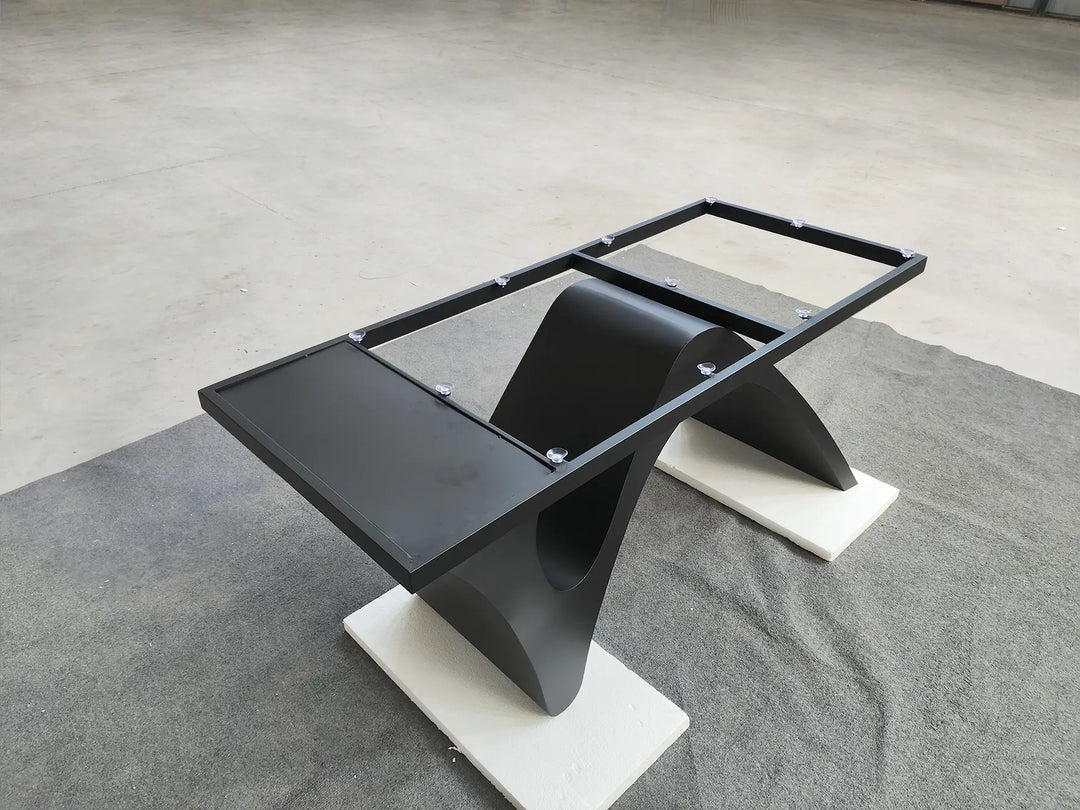 Elevated angled view of the MTL20 table base showing the rectangular tabletop support frame and curved metal structure