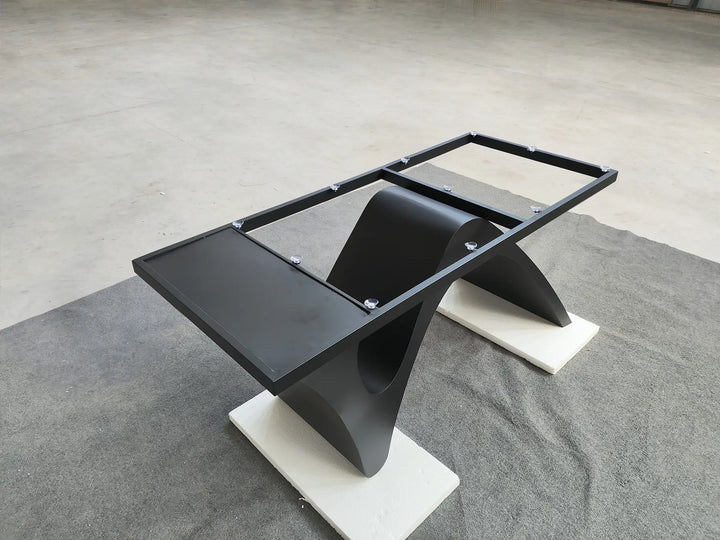 Elevated angled view of the MTL20 table base showing the rectangular tabletop support frame and curved metal structure