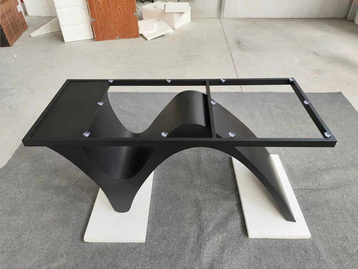MTL20 sculptural metal table base with curved black X-shaped supports, silver-tone floor plates, and a rectangular upper frame