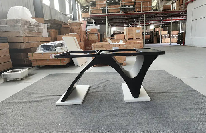 Front view of the MTL20 metal table base highlighting its intersecting curved supports and contrasting metal feet