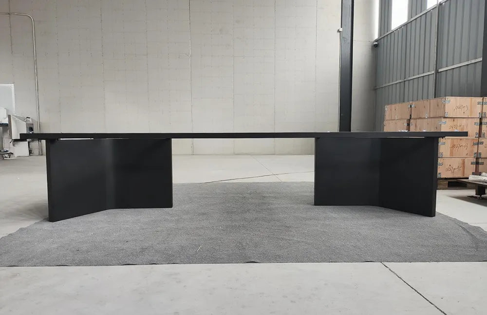 Profile view of the MTL22 black metal table base showing its two pedestal supports beneath the upper frame