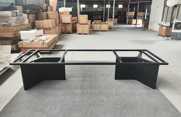 Front view of the MTL22 black metal table base featuring two trapezoid pedestal supports and a rectangular upper steel frame