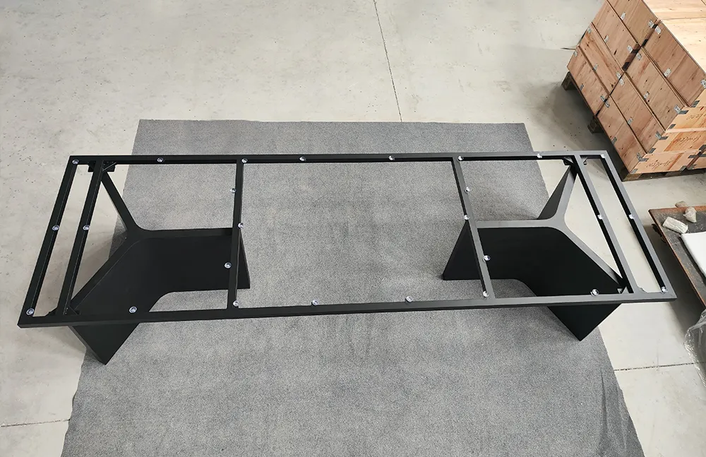 Side view of the MTL22 metal table base highlighting the angled pedestal supports and rectangular tabletop frame