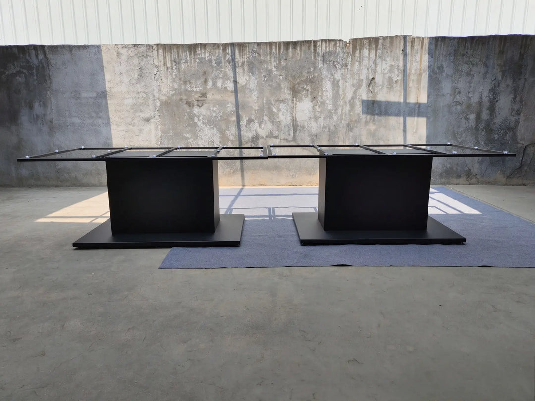 Angled view of the MTL35 metal conference table base showing its rectangular steel support frame and pedestal structure