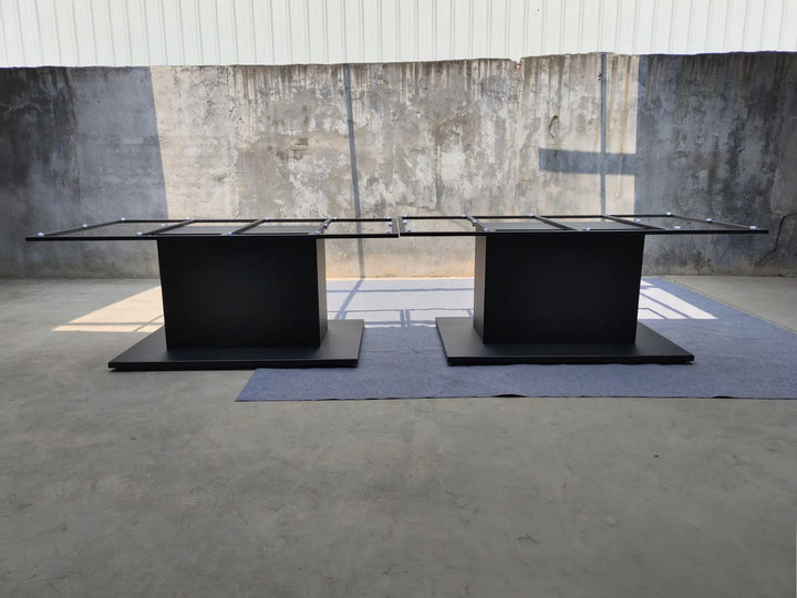 Angled view of the MTL35 metal conference table base showing its rectangular steel support frame and pedestal structure