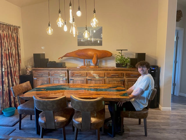 Close-up of Mystic Lagoon opaque resin layer blending with olive wood, highlighting the deep ocean-inspired colors and artistic craftsmanship.