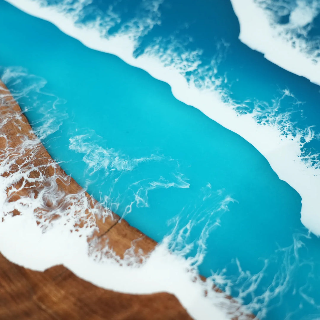 Layered white ocean wave detail in turquoise epoxy table by SeawaveTable