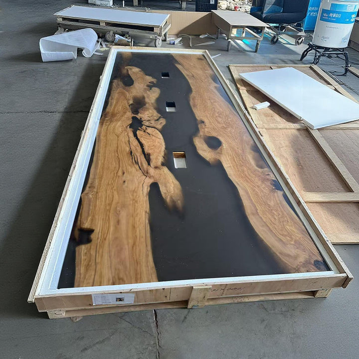 Detail shot of matte olive wood grey resin meeting table showing integrated power module