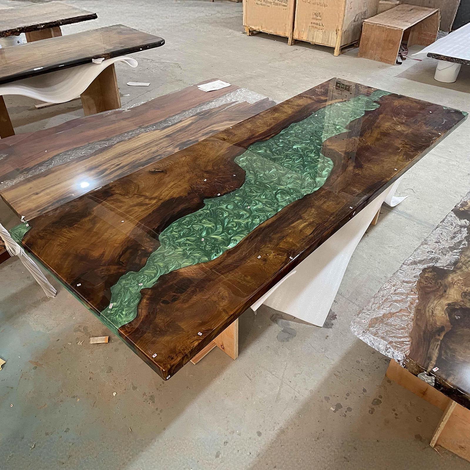 Rectangular olive wood Mystic Lagoon epoxy table adding a luxurious touch to modern home decor.