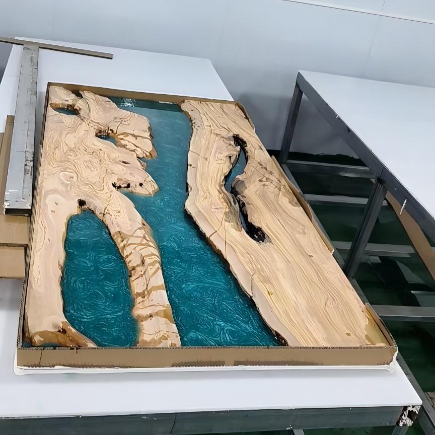 Side view of live edge olive wood table with Mystic Lagoon epoxy river and smooth matte finish.