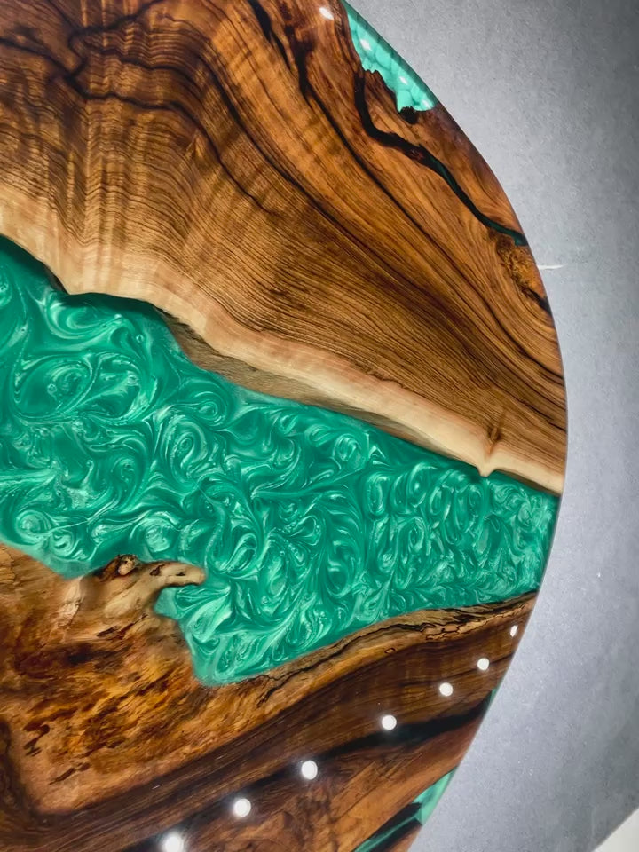 Custom round epoxy resin dining table with black walnut slab and elegant design